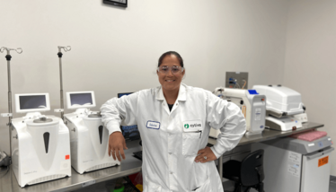 Sabrina Carmichael, CGT FastTrak Global Training Leader at Cytiva, is stood in a laboratory